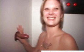 Blonde teen sucking dick through a glory hole